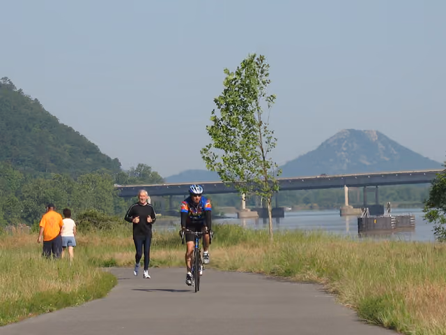 Arkansas River Trail — users enjoying the western portion of the trail with Pinnacle Mountain in the background, in central Arkansas