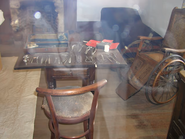 Peeking through the glass of the surgeon's work room at Fort Verde State Historic Park, we can see some tools of the trade