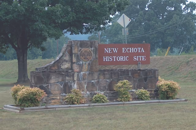 New Echota Sign between parking lot and Highway 255 as Entrance to New Echota Historical Site