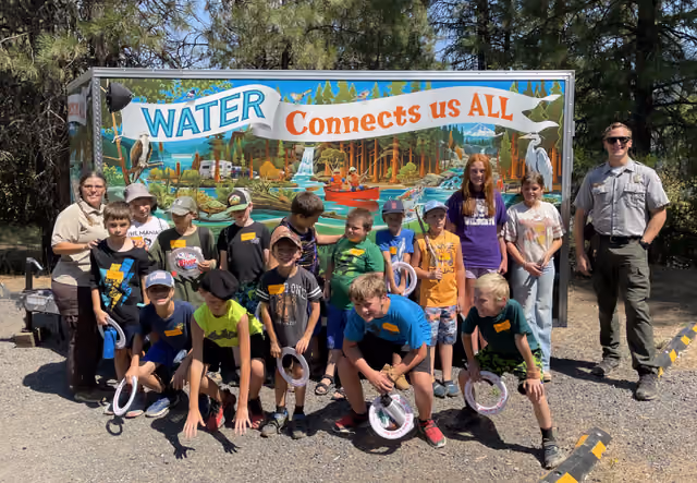 Children participating in the Dworshak Explorers Summer Camp pose at Dworshak State Park in Idaho in the United States on the final day…