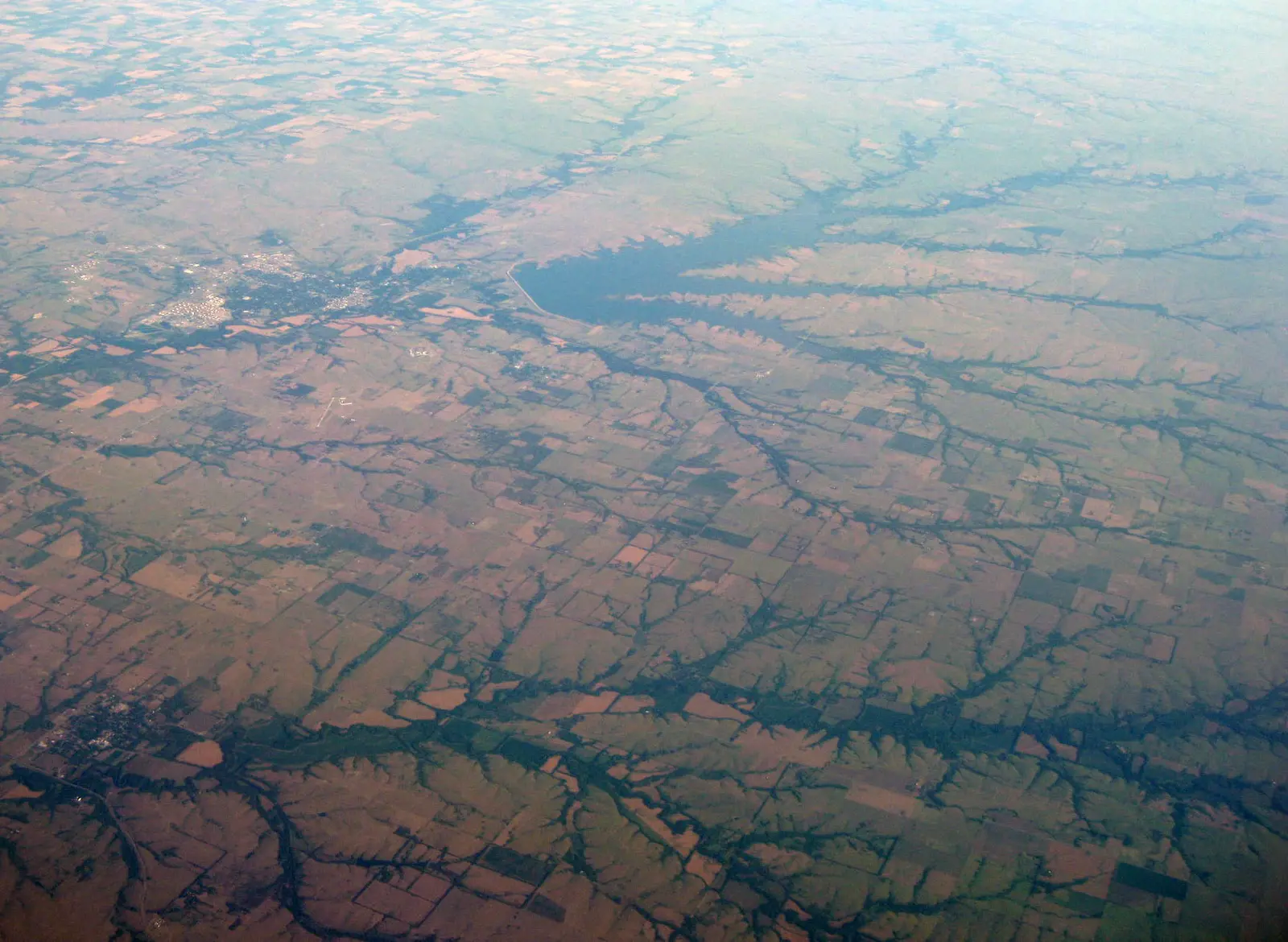Oblique air photo of El Dorado, Kansas and El Dorado Lake , facing northwest