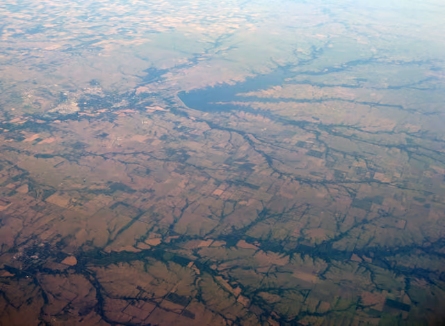Oblique air photo of El Dorado, Kansas and El Dorado Lake , facing northwest