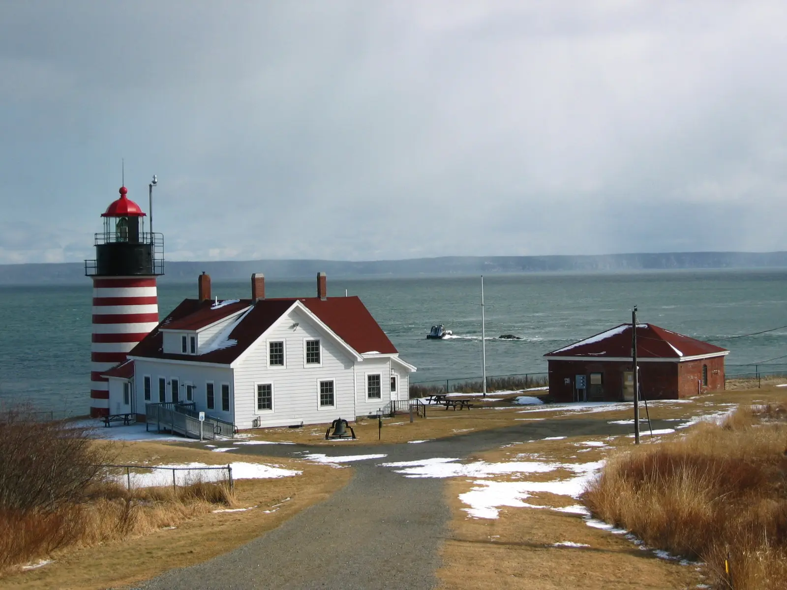 Foreground, West Quoddy Head Light , Lubec, Maine ; background, Quoddy Narrows and Grand Manan Island amid a snow storm