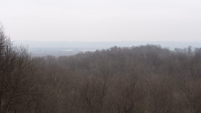 A distant, hazy view of the Mississippi River from the Trail of Tears State Park in Cape Girardeau County, Missouri Keywords: trte;…
