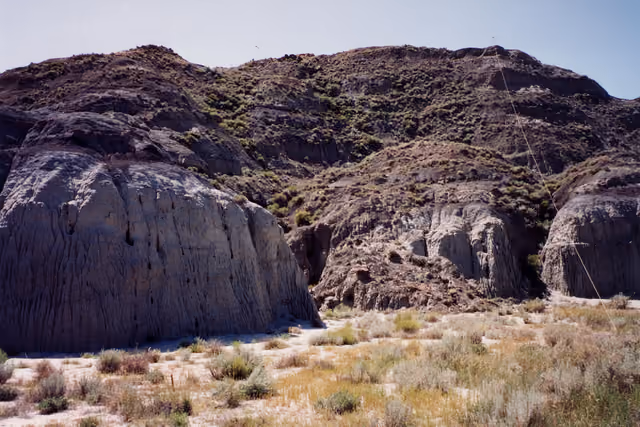 This south view includes the middle portion of the Upper Cretaceous (Maastrichtian)-age Hell Creek Formation at the entrance of…