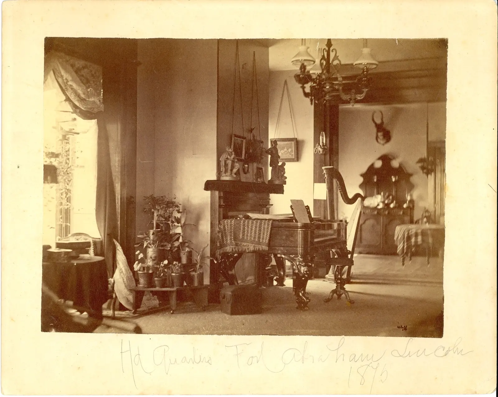 LIBI_00019_00580; This item is an albumen, card-mounted photograph of the interior of the Custer home at Fort Abraham Lincoln