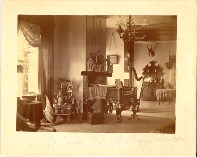 LIBI_00019_00580; This item is an albumen, card-mounted photograph of the interior of the Custer home at Fort Abraham Lincoln