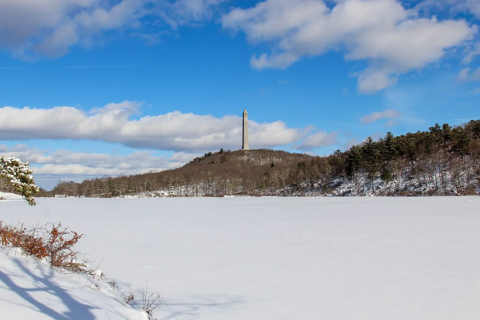 The monument at High Point state park viewed from Lake Marcia on a snowy day