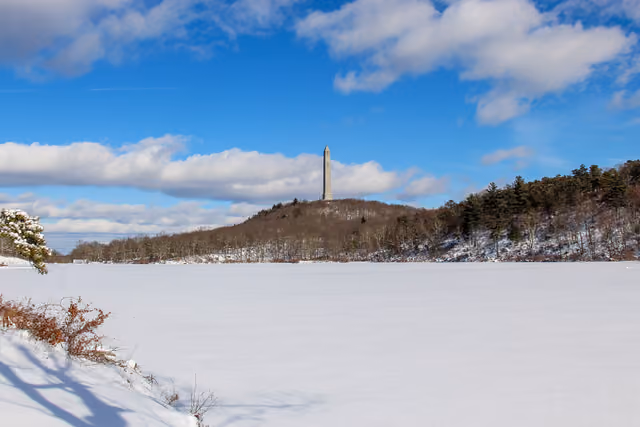 The monument at High Point state park viewed from Lake Marcia on a snowy day