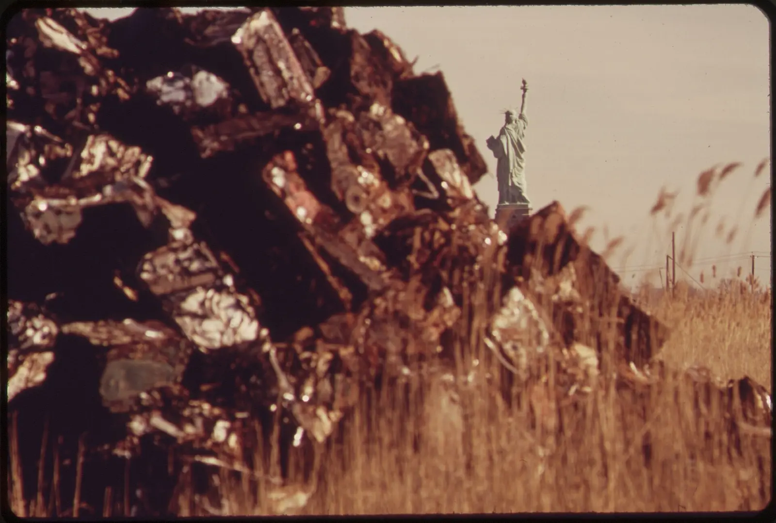 A SETTING FOR THE STATUE OF LIBERTY NOT OFTEN SEEN BY TOURISTS. THIS DUMPING AND LANDFILL AREA IS THE SITE OF THE... - NARA -