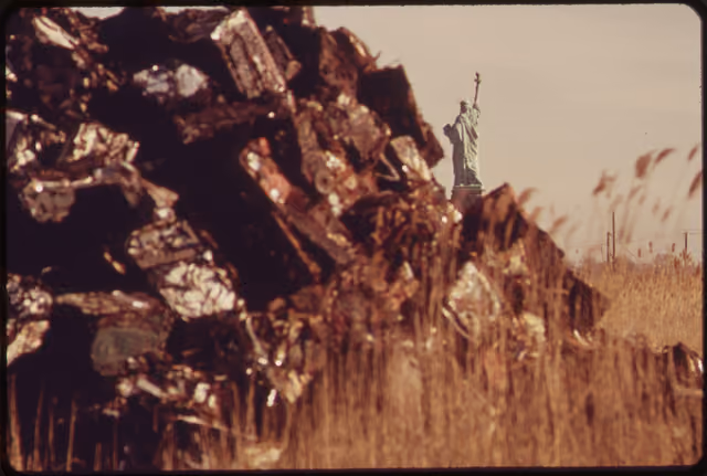 A SETTING FOR THE STATUE OF LIBERTY NOT OFTEN SEEN BY TOURISTS. THIS DUMPING AND LANDFILL AREA IS THE SITE OF THE... - NARA -