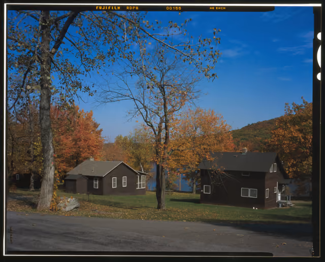 LAKE TAGHKANIC STATE PARK, WOOD-SIDED CABINS WITH THE LAKE IN THE BACKGROUND, VIEW NW. - Taconic State Parkway, Poughkeepsie, Dutchess…