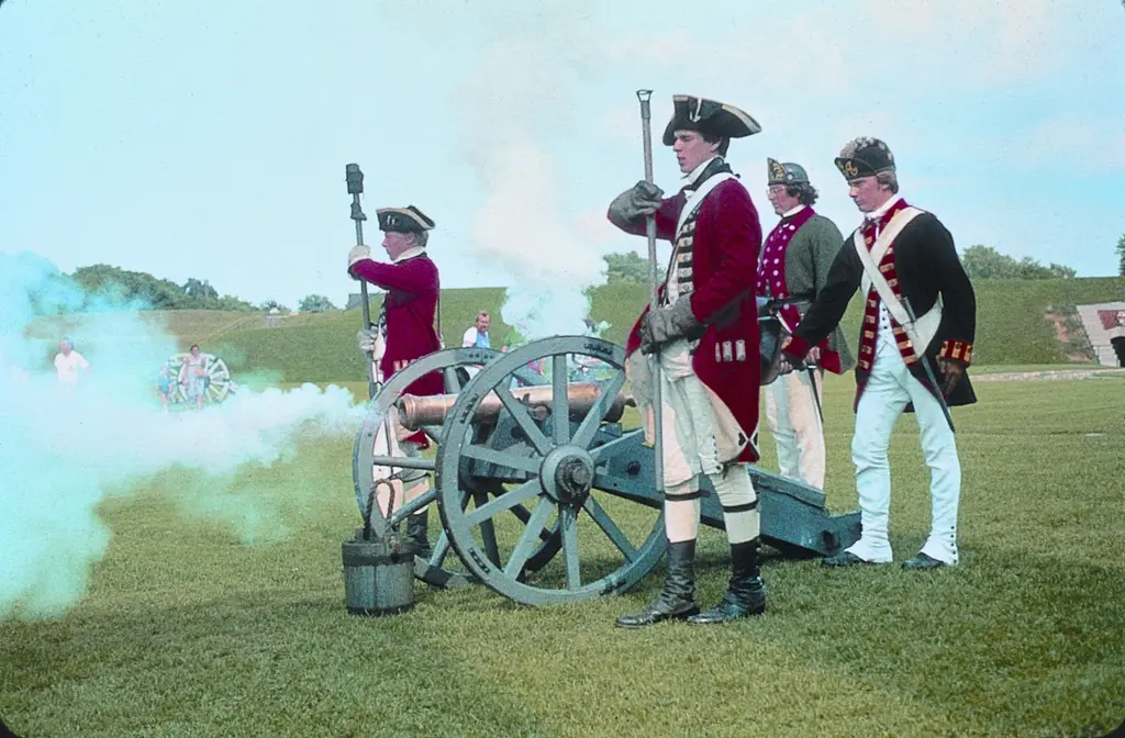 Scope and content: The original finding aid described this photograph as: Original Caption: Byway visitors peer through cannon smoke, as…