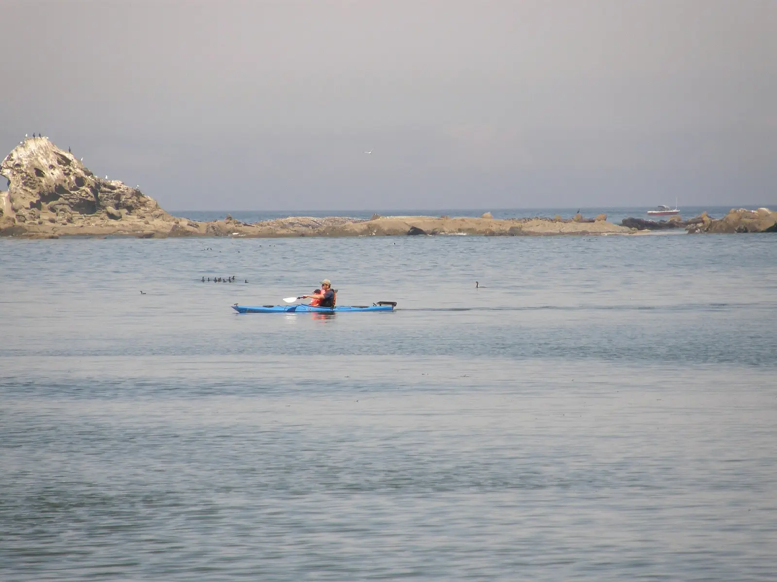 A kayaker at Sunset Bay, Oregon, USA