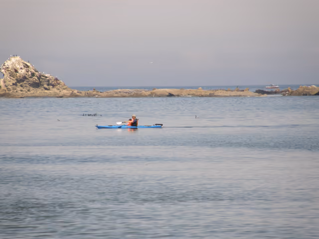 A kayaker at Sunset Bay, Oregon, USA