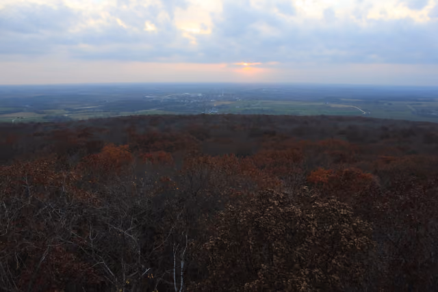 Great view at sunset from west tower looking at forest and fields at Blue Mound State Park